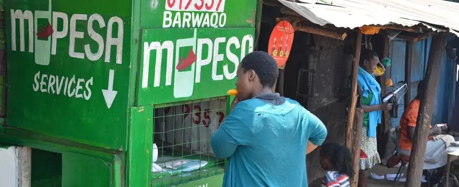 A picture of a Kenyan citizen at an M-PESA outlet.